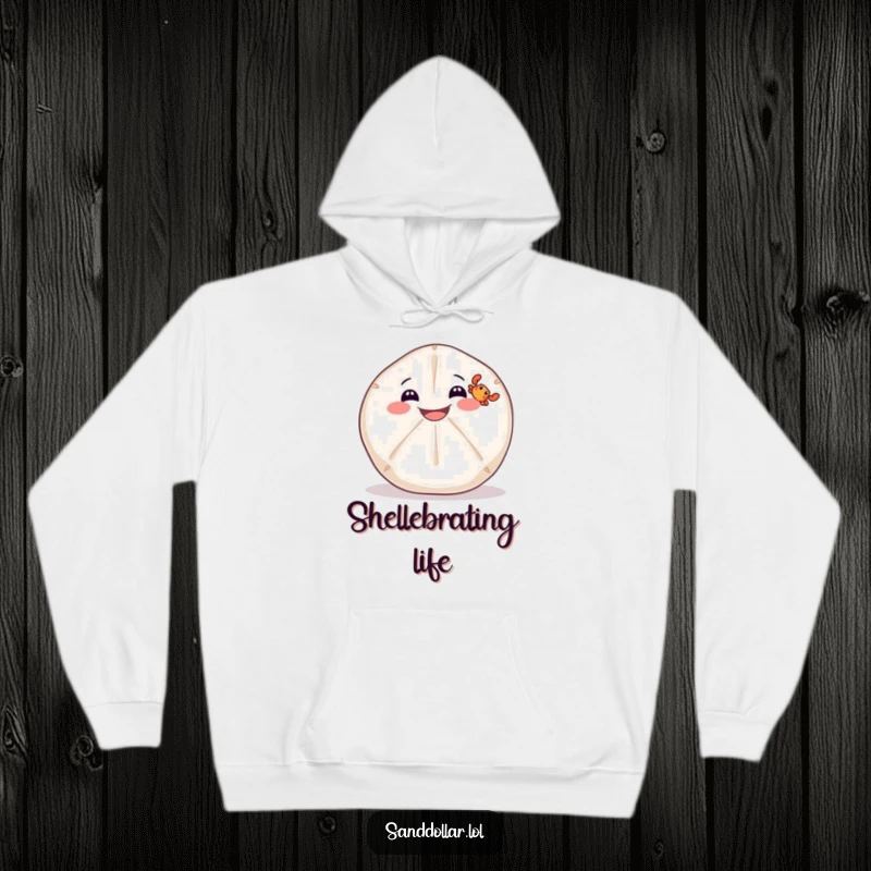 Funny hoodie featuring a wide-grinning sand dollar balancing a tiny crab, perfect for cozy days by the sea.